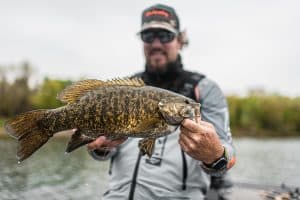 matt peters holding a smallmouth bass caught at mille lacs lake minnesota