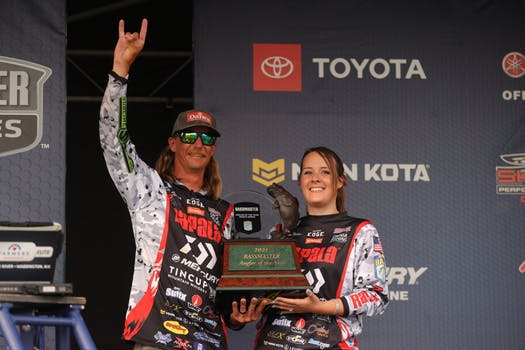 seth feider holding bassmaster angler of the year trophy