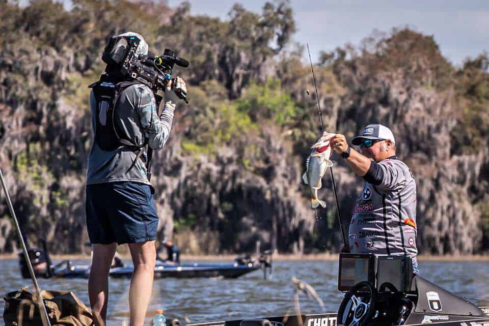 buddy gross holding catch during bassmaster elite at harris chain