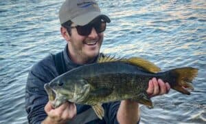 A man holding a giant smallmouth bass recently caught