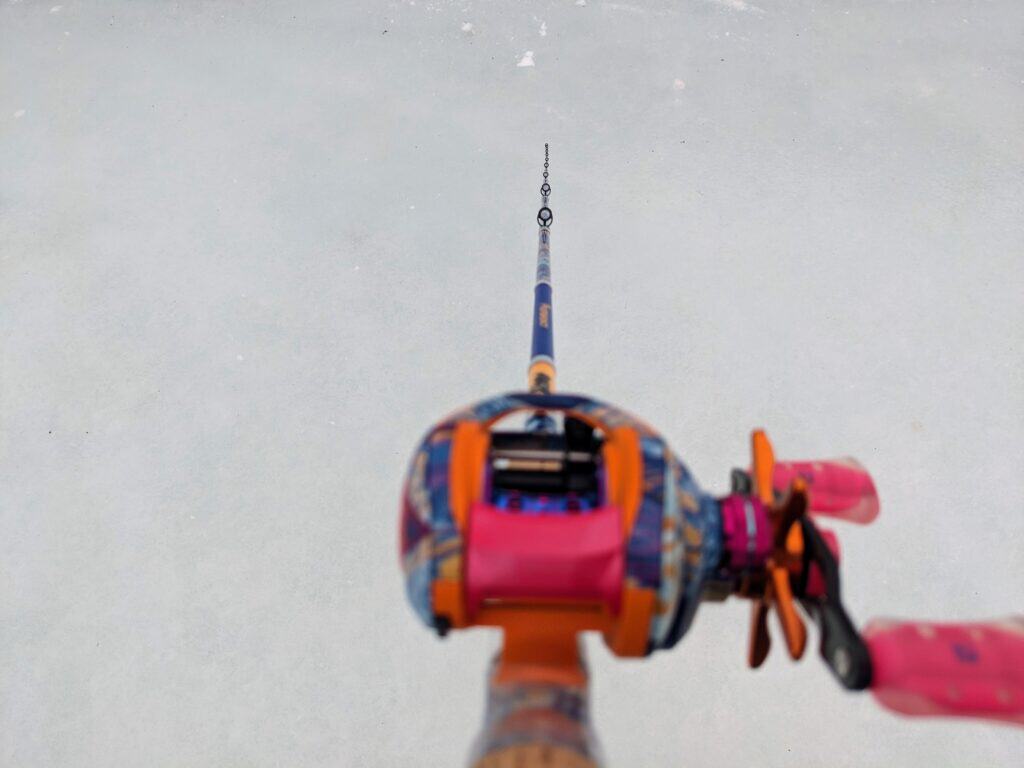 Profishiency Krazy Rizz Baitcast Combo - top view, of rod and reel combo focusing on rod guides from bottom to tip